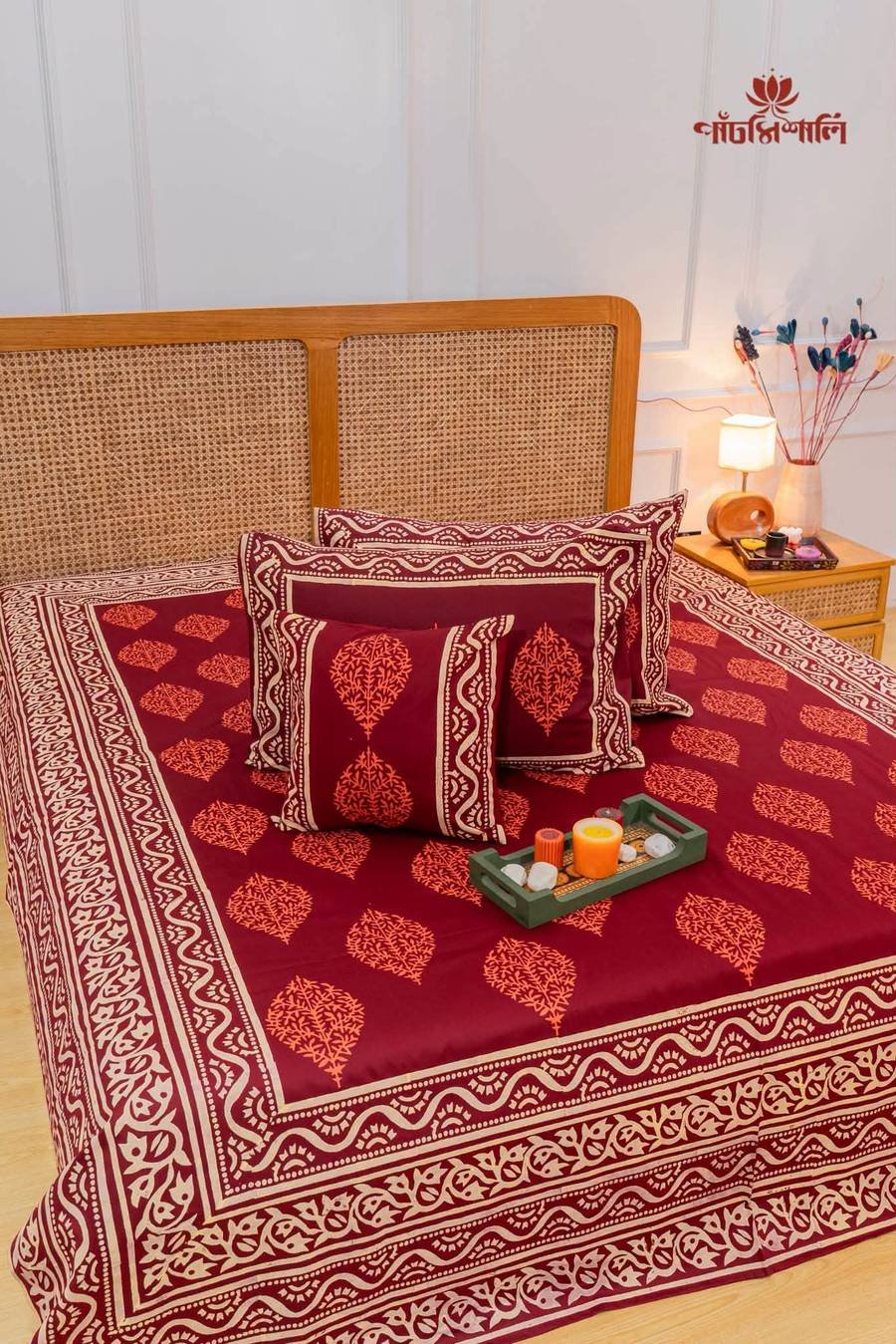 Maroon botanical bedsheet, bedside styled